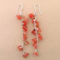 Dangling coral chip earrings with silver hooks