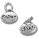 Two silver "Believe" and "Wish" charms