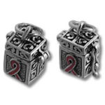 Pair of ornate cube charms with pink ribbons