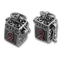 Pair of ornate cube charms with pink ribbons