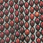Dark red oval pearl beads arranged in rows