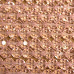Close-up of pink beaded fabric