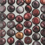 Iridescent burgundy round pearls in grid