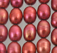 Close-up of red metallic oval pearl beads