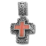 Ornate silver cross pendant with red inlay
