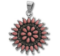 Silver sunburst pendant with pink stones