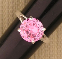 Pink gemstone solitaire ring with silver band
