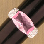 Pink marquise gemstone ring with diamond accents