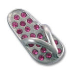 Silver flip-flop studded with pink gems