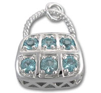 Silver purse charm with six blue gemstones
