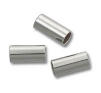 Three silver cylindrical metal crimp tubes