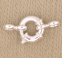 Silver toggle clasp on beige fabric