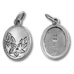 Two oval silver pendants showing front and back