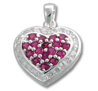 Heart-shaped pendant with red gemstones