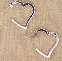 White heart-shaped hoop earrings with black trim