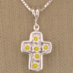 Silver cross pendant with yellow flowers