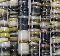 Close-up of striped shell beads on strands
