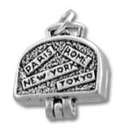 Silver charm showing Paris, Rome, New York, Tokyo