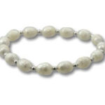 Oval white beaded bracelet with silver spacers
