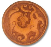 Round bronze medallion with stylized dragon