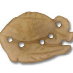 Carved fish-shaped pendant with five holes