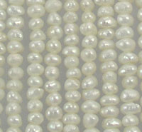 Close-up of cream-colored pearl strands