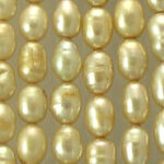 Close-up of lustrous golden pearl beads