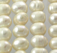 Close-up of ivory freshwater pearl strands