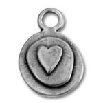Round silver charm with heart design