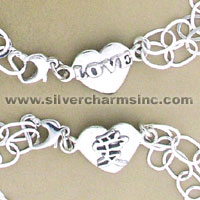Two silver heart charm bracelets with love