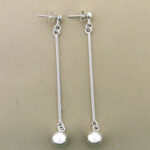 Pair of long silver bar earrings with pearls