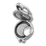 open silver locket with coin inside