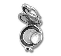 open silver locket with coin inside