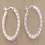 Pair of textured silver hoop earrings