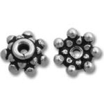 Silver flower-shaped spacer beads with dot accents
