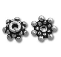 Silver flower-shaped spacer beads with dot accents