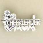 Silver chef-themed metal pin