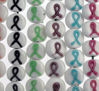 Array of awareness ribbon pins in various colors