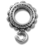 Ornate metal ring with dangling crescent charm