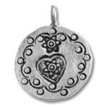 Round silver pendant with heart and floral motifs