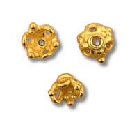Three small gold beads on white background