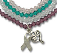 Multistrand beaded bracelet with ribbon and heart charms