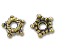 Two antique gold star-shaped spacer beads