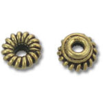 Two antique brass fluted spacer beads