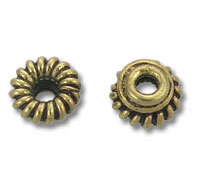 Two antique brass fluted spacer beads