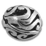 Ornate silver bead with black swirls