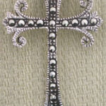 Ornate silver filigree cross pendant