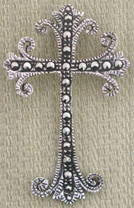 Ornate silver filigree cross pendant