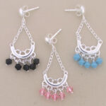 Three chandelier earrings with black, pink, turquoise beads