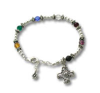 Silver beaded charm bracelet with dangling charms
